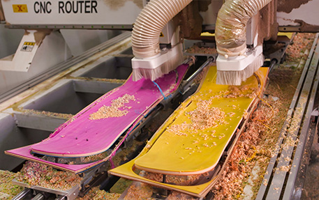 NAVA CNC machines shaping skateboard decks