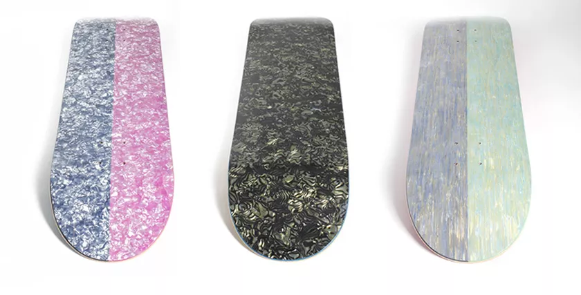 Skateboard decks with patterned graphic finishes