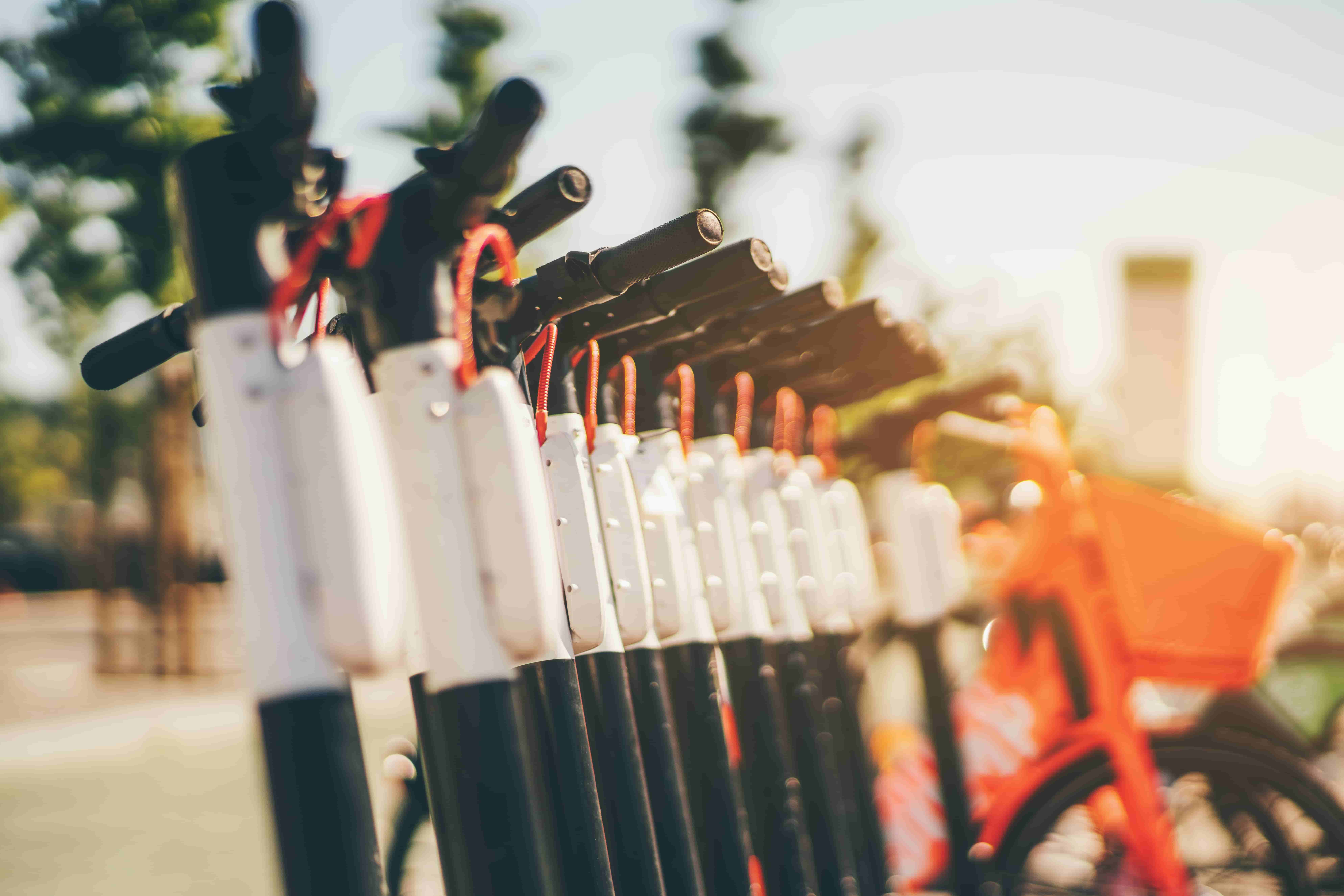 Row of scooters displayed outdoors
