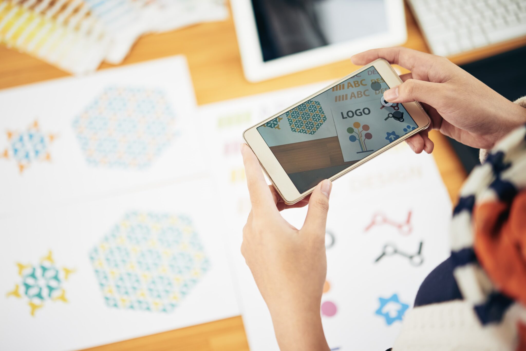 Designer reviewing drawings and product ideas on a desk