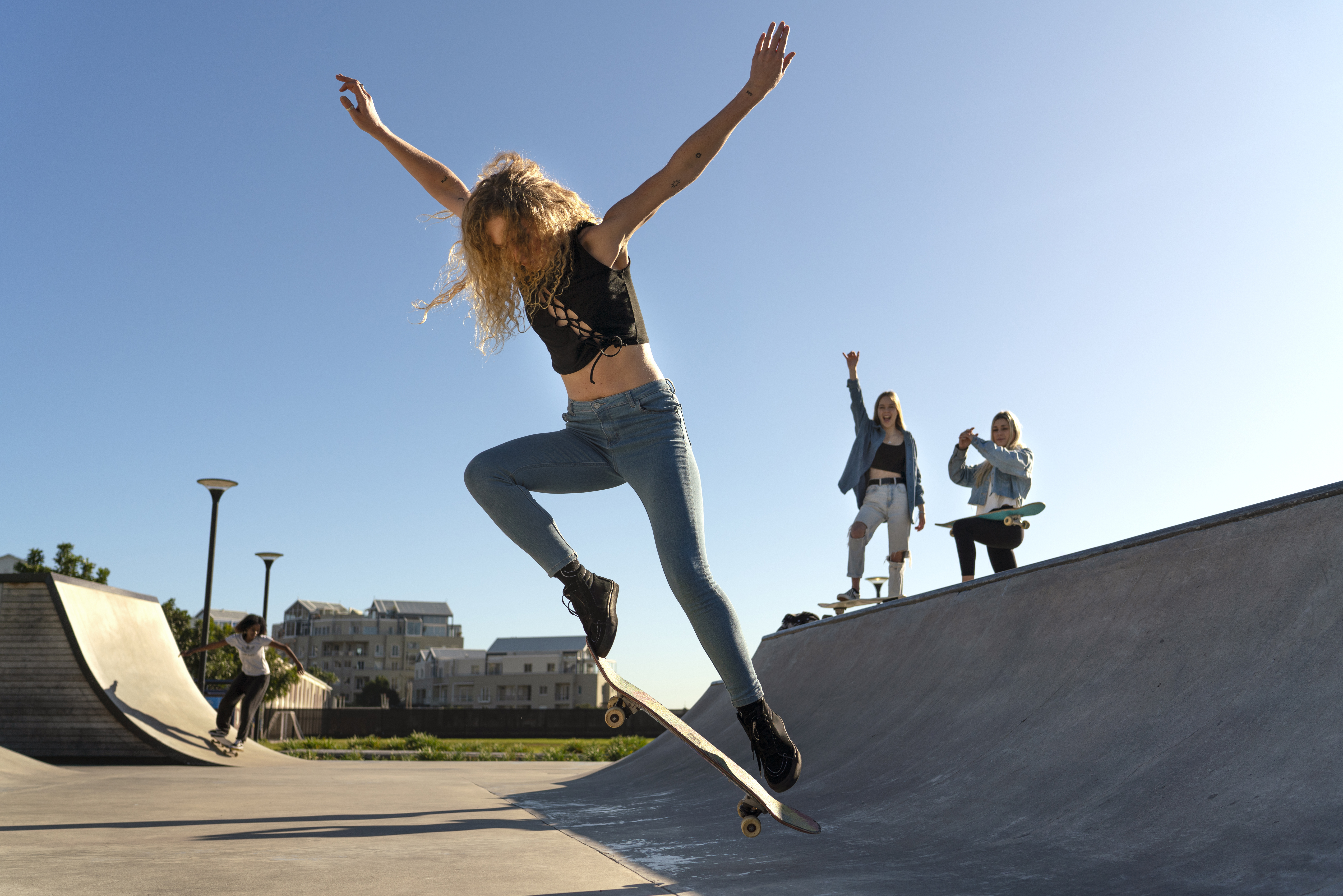 Skateboarder performing a trick at an outdoor skatepark