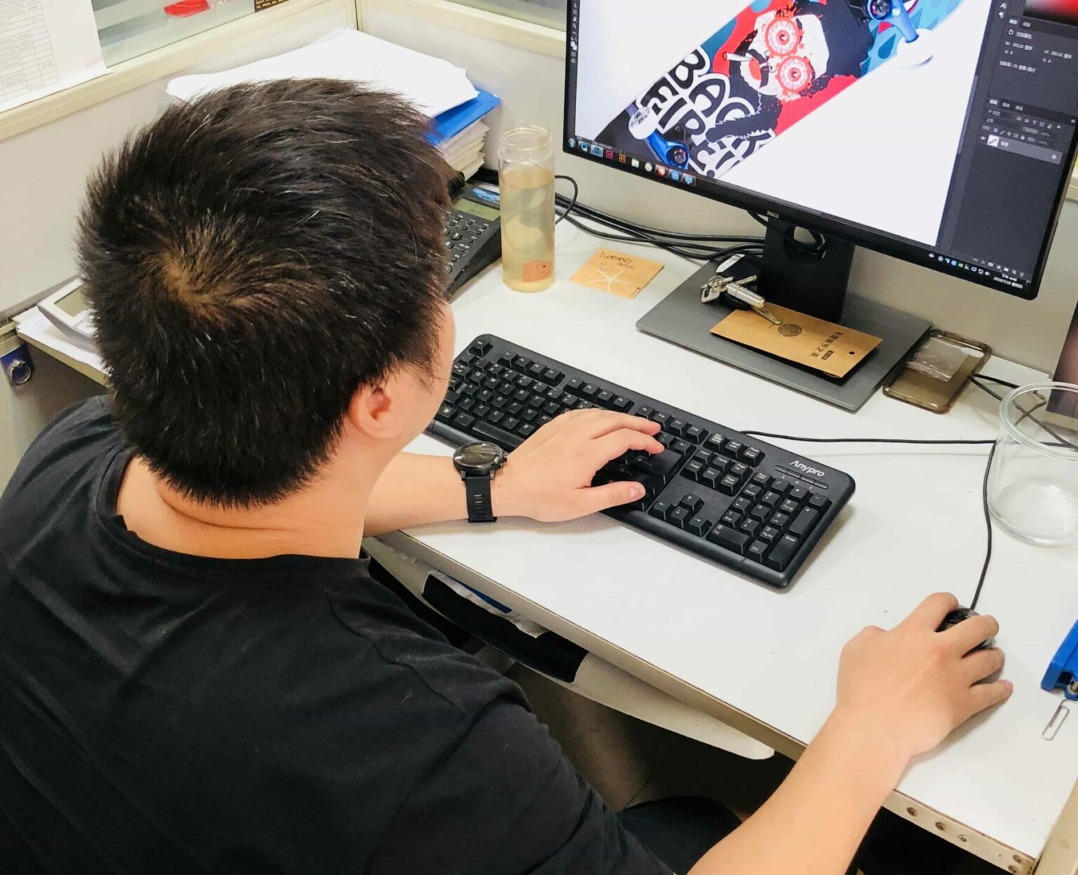 Product designer working at a computer